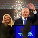 Benjamin Netanyahu and his wife, Sara, wave as Netanyahu speaks following the announcement of exit polling.