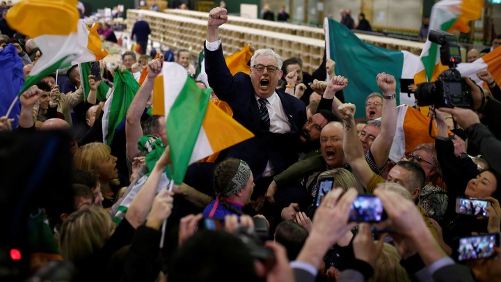 A Sinn Fein candidate celebrates with supporters after the announcement of voting results in Ireland's national election.