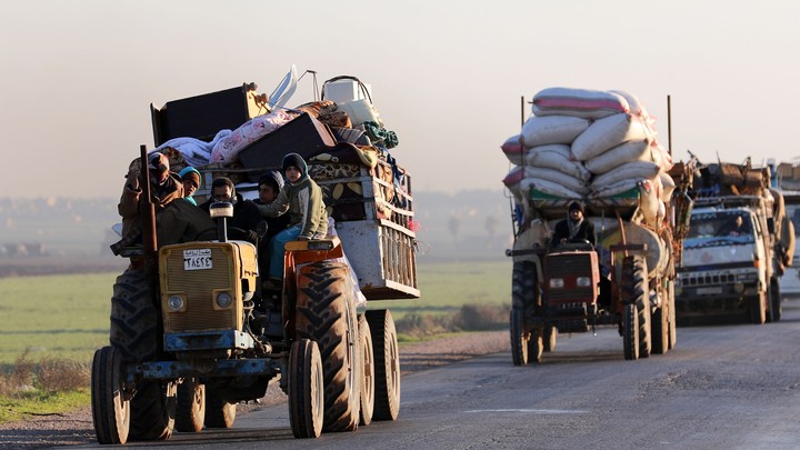 Convoys of displaced Syrians leave Idlib in January.