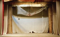 An image of an empty stage at a theatre