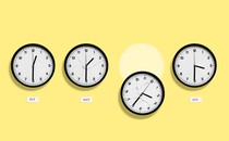 four clocks showing different time zones