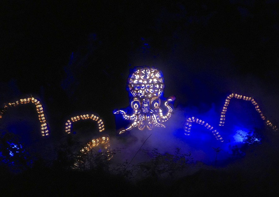 A frightening octopus installation made up of many carved pumpkins