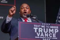 Mark Robinson speaks in front of a Trump-Vance podium