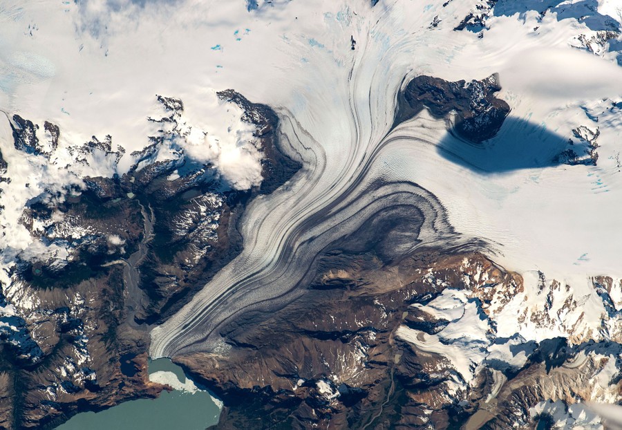 An orbital view of a flowing glacier
