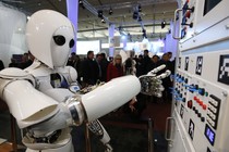 The humanoid robot AILA (artificial intelligence lightweight android) operates a switchboard