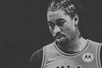 Black-and-white photo of the NBA player Jaden Ivey in a Bulls jersey with his eyes cast slightly downward.