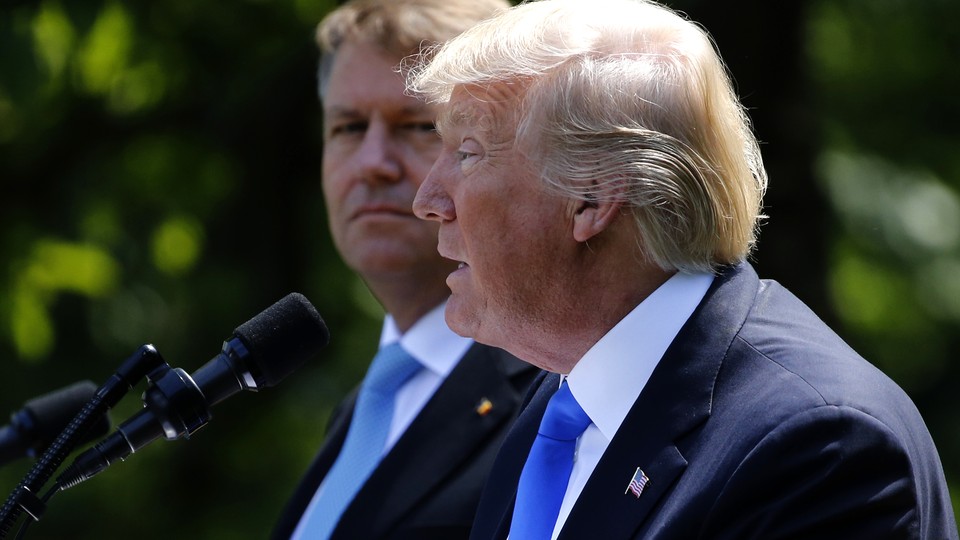 President Trump reacts while addressing a joint news conference with Romanian President Klaus Iohannis on June 9, 2017. 