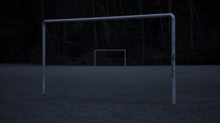 An abandoned soccer field in the dark