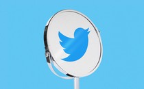 An image of the Twitter logo in a mirror.