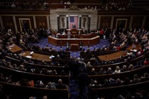 Representatives are seated for a vote in the House Chambers