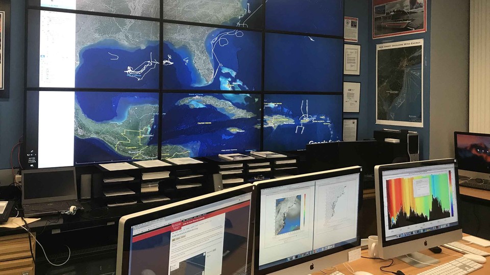 Screens monitoring data from a hurricane