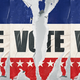 An illustration of a red, white, and blue "VOTE" poster with a tear down its center.