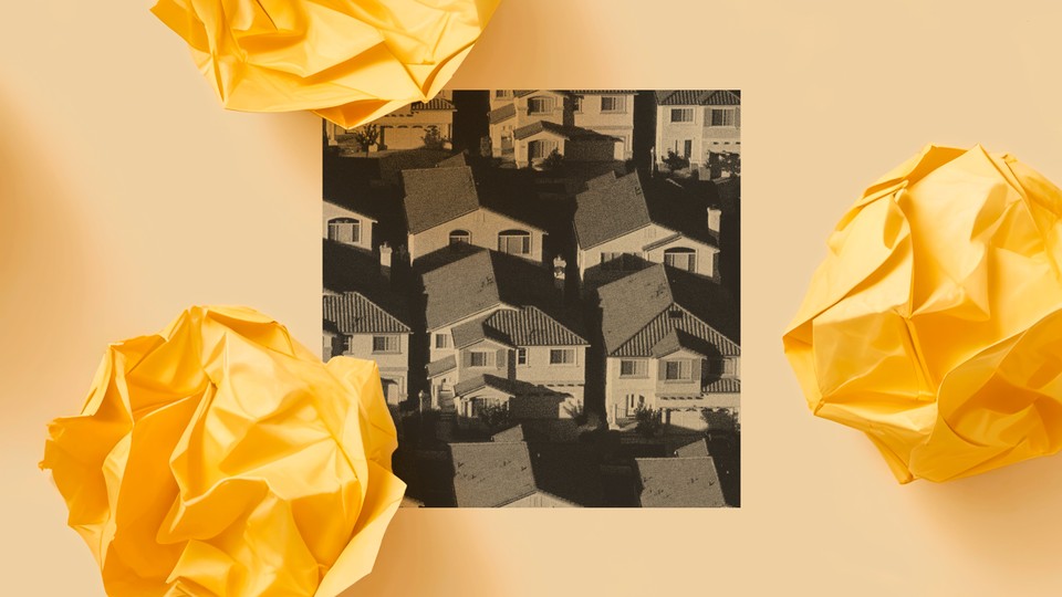 A black-and-white photo showing a handful of densely arranged single-family homes