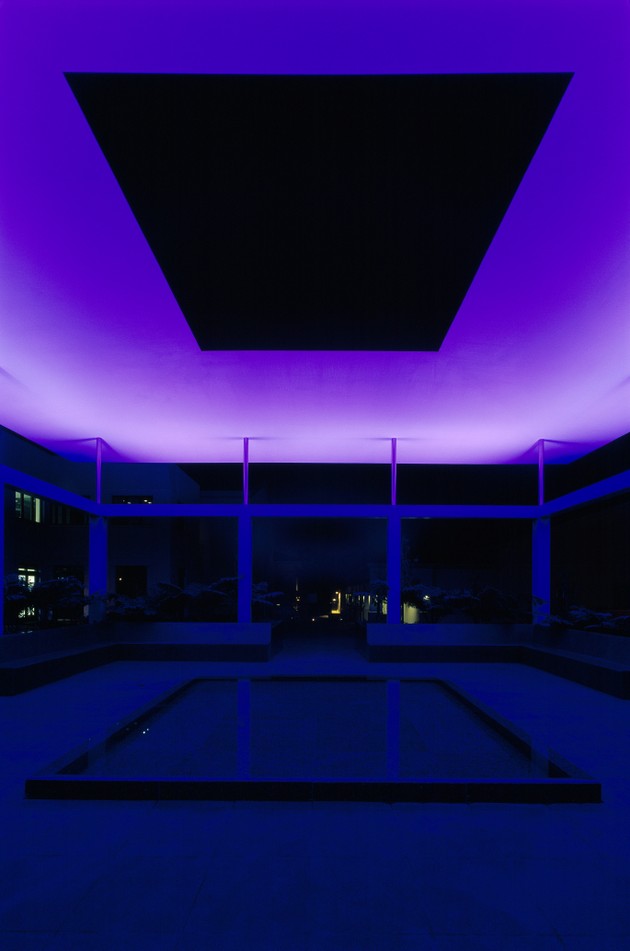Purple lighting fills a dark room. A rectangle fills the floor and ceiling.