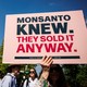 an anti-monsanto sign at the people v poison rally