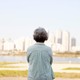 A person with graying hair looking out at the skyline