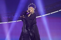 Madonna dressed in black robes with light beams framing her