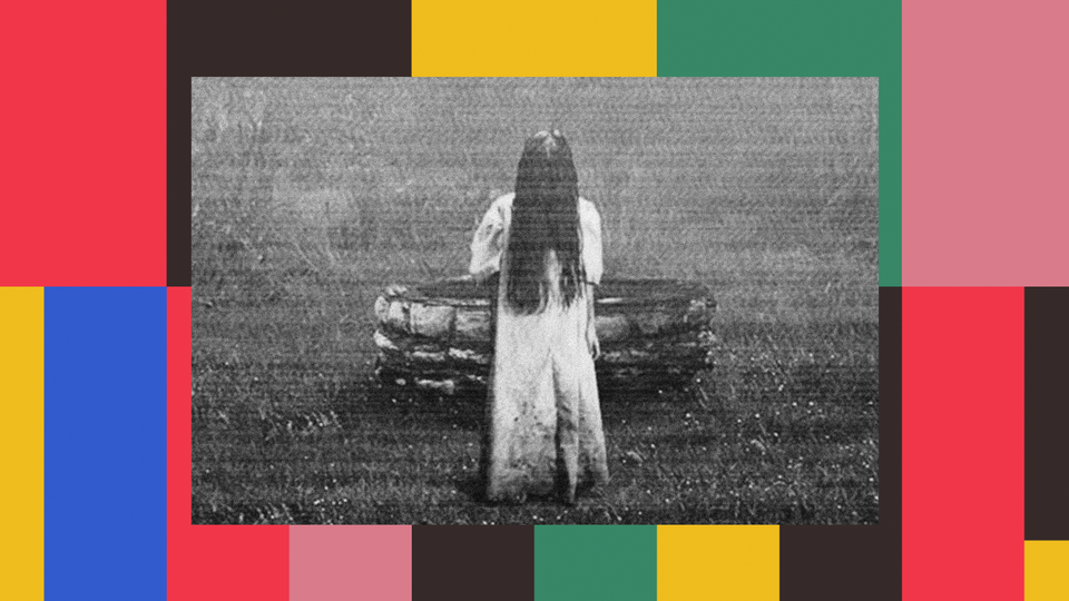 Samara, a girl in a long white dress and with long black hair covering her face, exits a well in "The Ring."