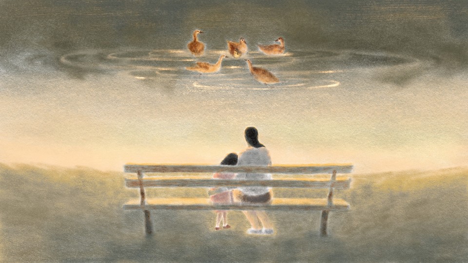 A mother and her child sit at a pond, watching a duckling surrounded by a circle of adult ducks.