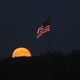 A full moon and the American flag.