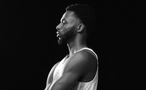 A black-and-white photo of Andrew Wiggins in profile