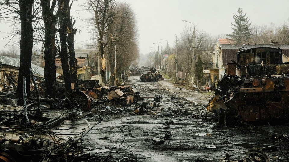 A  street strewn with destroyed tanks and debris