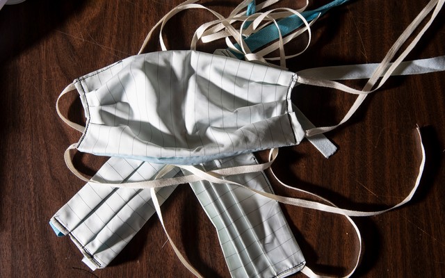 Several cloth masks lying on a table