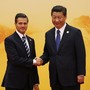 Mexico's President Nieto shakes hands with China's President Jinping.