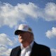 US President Donald Trump is out of focus in the photo, while the blue cloudy sky behind him is in focus