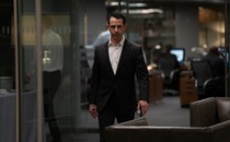Kendall Roy of "Succession" marching through an office
