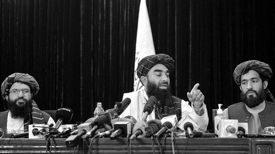 Taliban spokesman Zabihullah Mujahid addresses a news conference in Kabul.