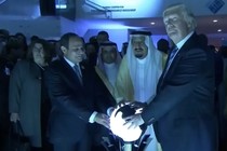 Donald Trump places his hands on a glowing orb in Riyadh, Saudi Arabia, in May 2017.