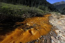 Water flows down Cement Creek just below the site of the blowout at the Gold King mine which triggered a major spill of toxic wastewater.