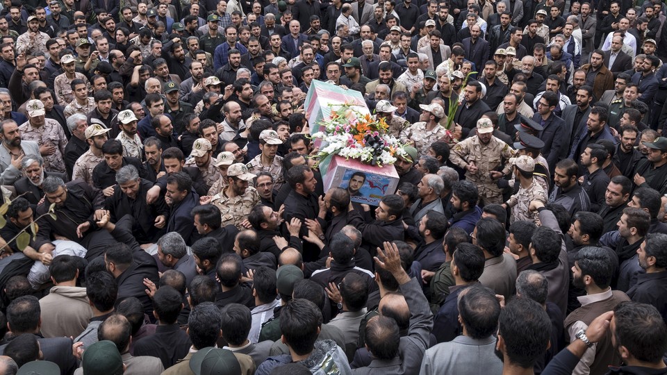 Mourners carry the coffin of an Iranian Revolutionary Guard Corps soldier killed in Syria in 2015.