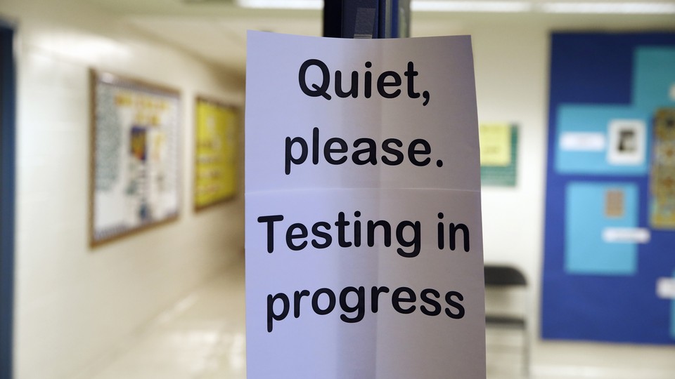 A sign asking people to be quiet while testing takes place