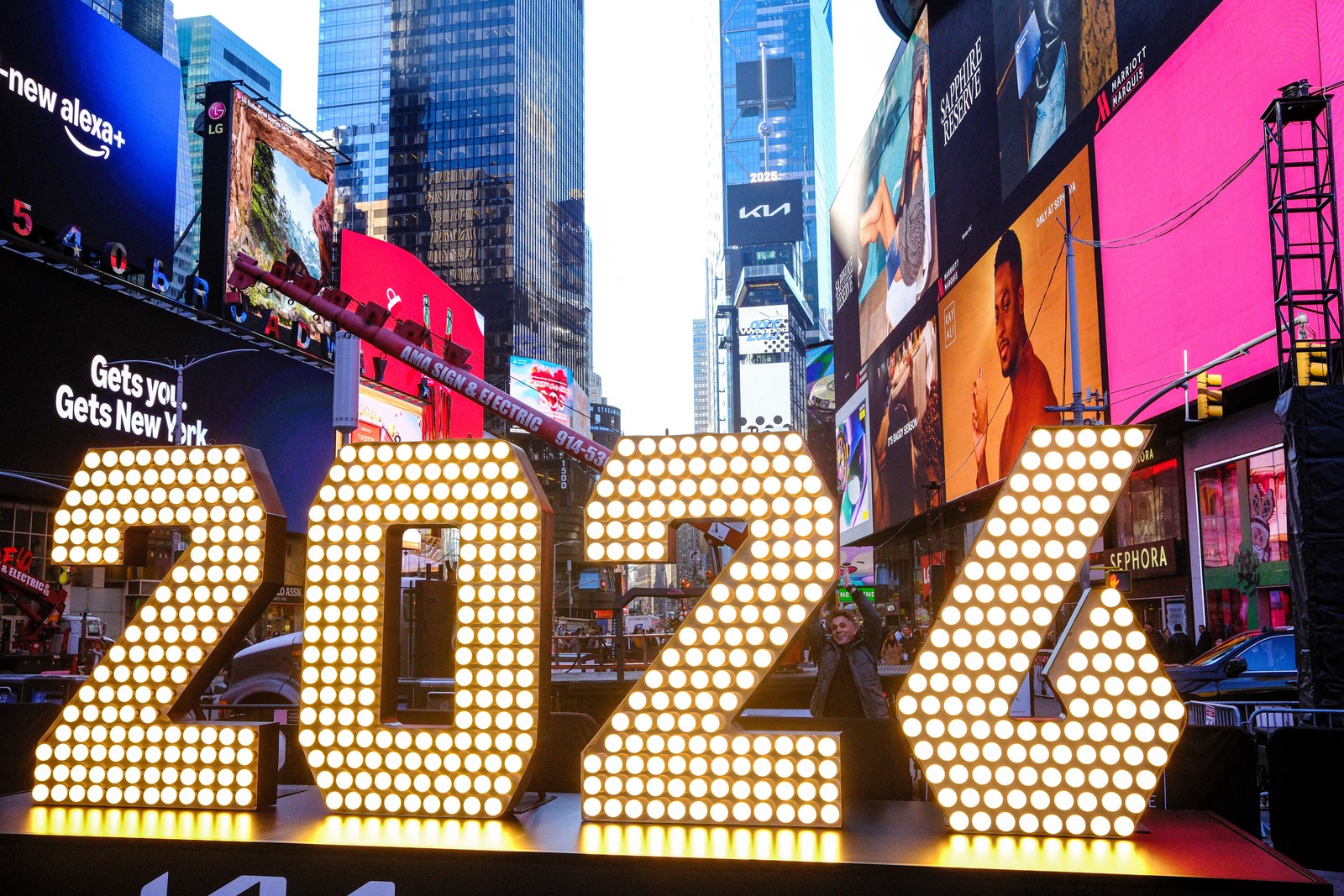 Tall illuminated numerals spell out '2026,' seen in New York's Times Square.
