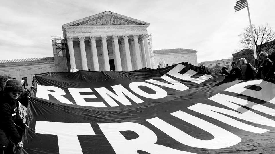 A photo of a banner outside the Supreme Court that reads: Remove Trump