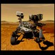 The gold moxie box is examined in a lab; the Perseverance rover carries it on Mars