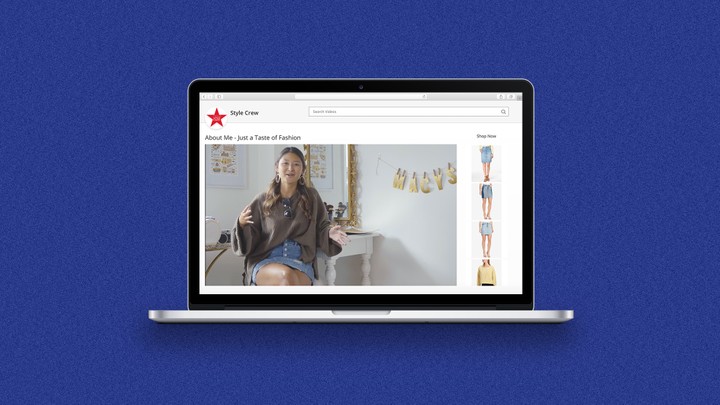 A laptop shows a video a girl sitting and gesturing in a decorated room