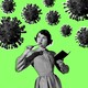 A photo illustration of a girl wondering with a pencil and a notebook in hand, looking at coronavirus particles floating around her.