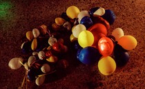 photo of a string of balloons partially or fully deflated