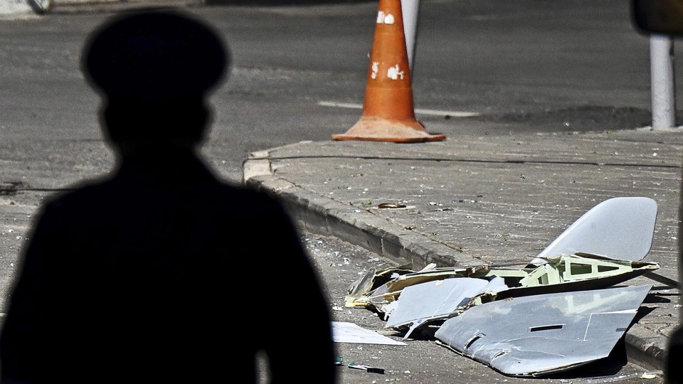 Photo of a dark figure and debris following a drone attack on Moscow
