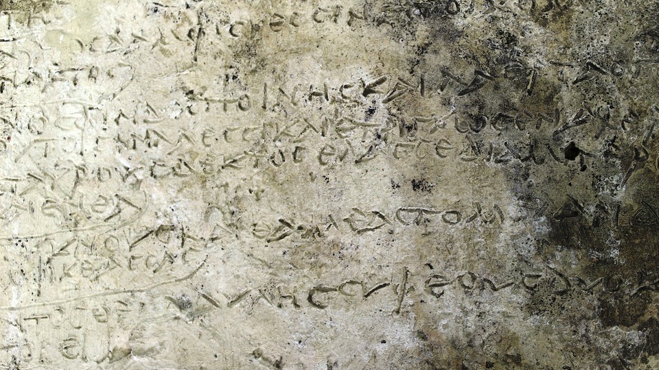 A slab found in Greece, dated to the Roman period, is inscribed with verses from the Odyssey.