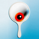 A photo-illustration of a handheld mirror with a red eyeball reflected inside