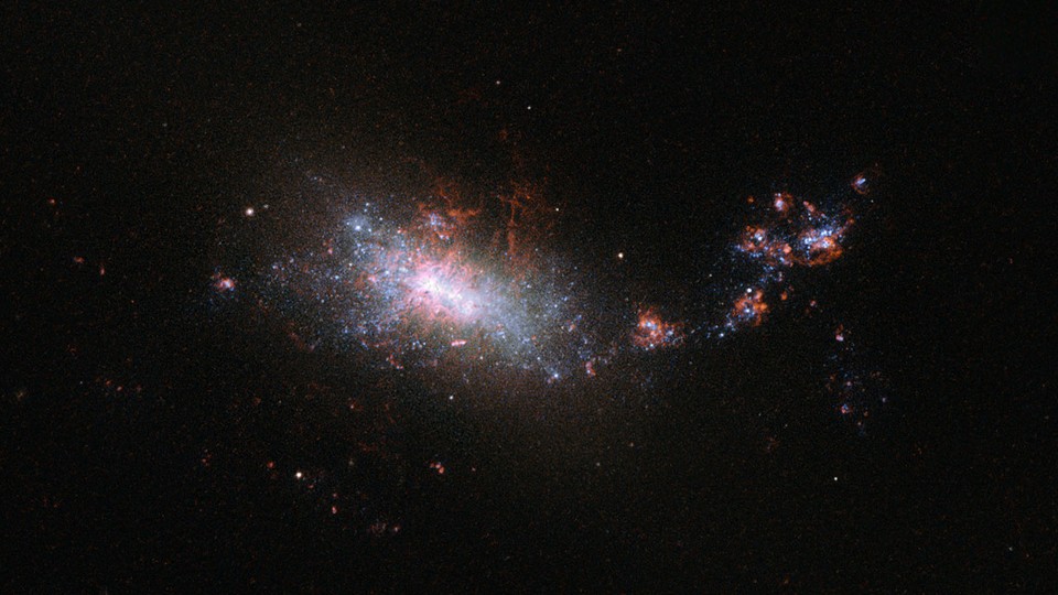 A sparkling galaxy is seen through the Hubble Space Telescope