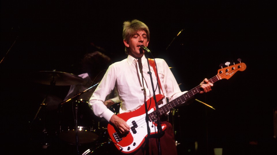 Nick Lowe performs at the Poplar Creek Music Theater in 1984.