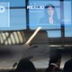 A news photo from an airport showing Real ID signs for travelers