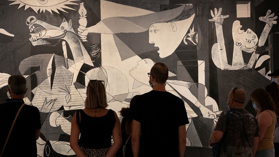 People looking at Guernica
