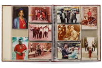 photo of physical photo album open to spread with 10 photos of people in various groupings