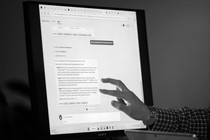 a hand interacting with the AI-powered Microsoft Bing search engine and Edge browser